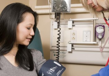 A patient's blood pressure being taken