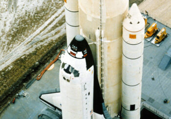 The Space Shuttle Columbia on its launch pad mounted to its external fuel tank and two solid rocket boosters in 1981. These solid rocket boosters have no connection to the boosters discussed in this post. (Photo credit: US National Archive / public domain)